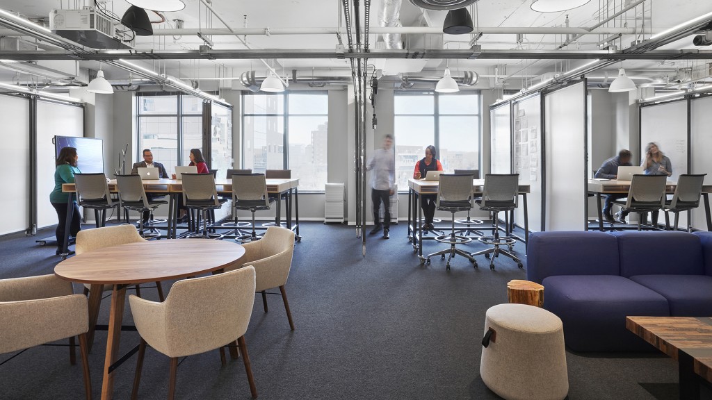 A room with tables and chairs.